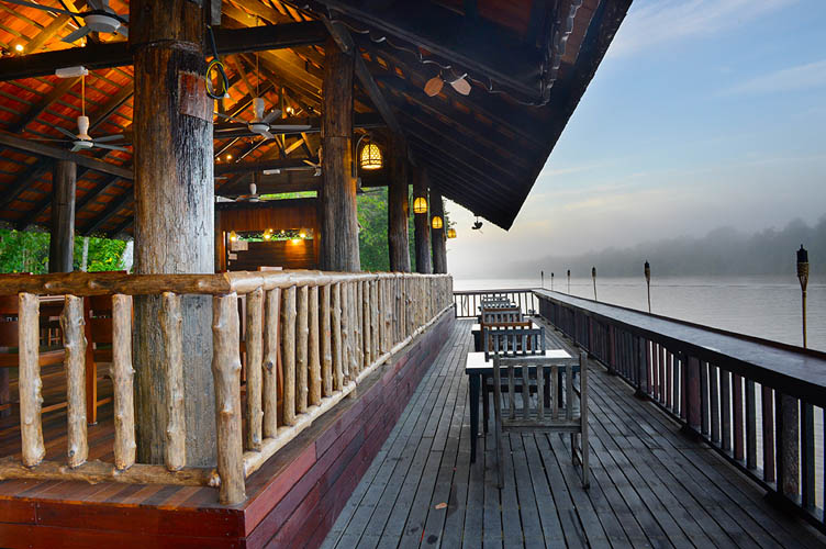 Riverside view of Sukau Rainforest Lodge's Melapi restaurant